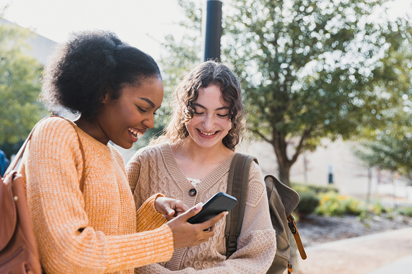 Teenagers looking at phone